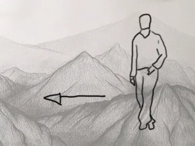 El hombre vuelve caminando hacia la izquierda entre las montañas.