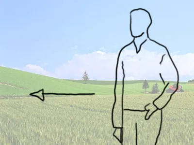 El hombre en el campo camina hacia la izquierda.